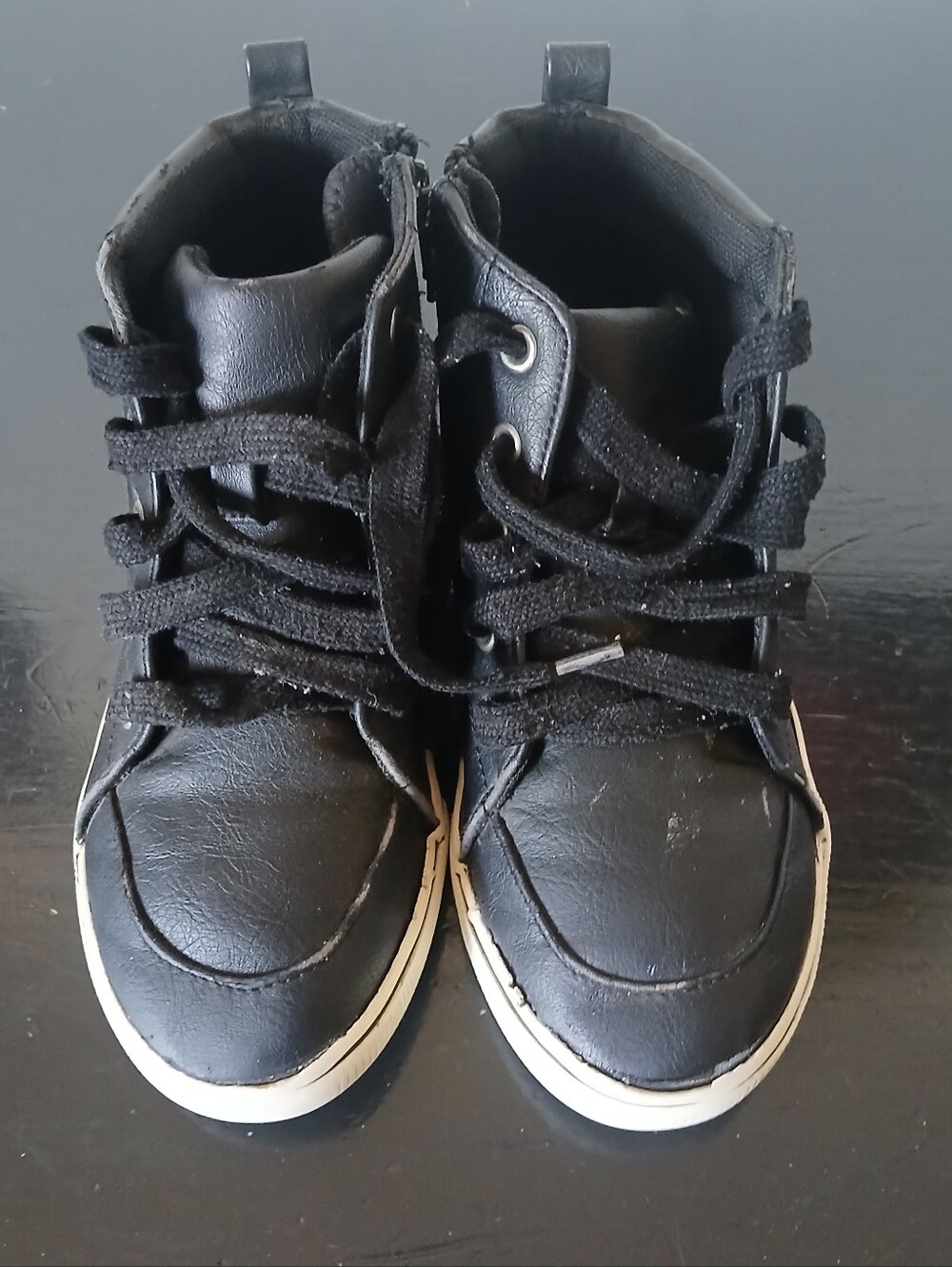 Black leather kids sneakers with white sole